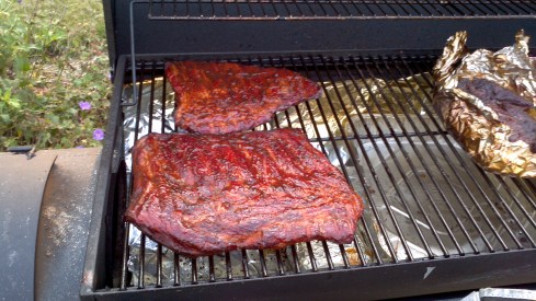 Slow smokin' and cookin' pork ribs.