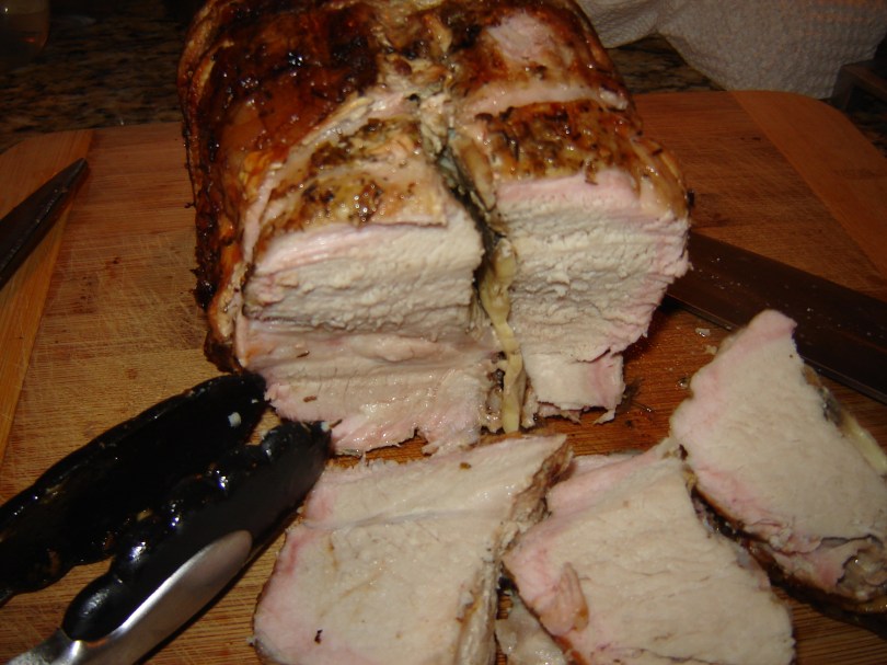 Grilled pork roast stuffed with Reggiano Parmigiano, mushrooms, and garlic from Paggi Pazzo