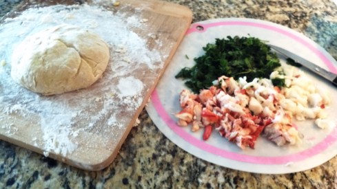 Preparing homemade Lobster Ravioli with fresh parsley and chopped lobster meat from Paggi Pazzo