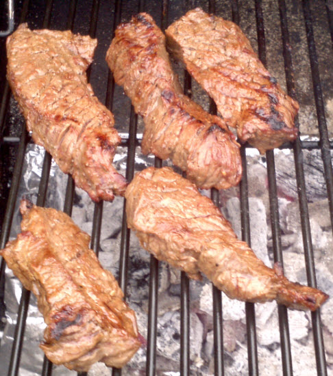Marinated Steak Tips over a wood charcoal fire and mesquite wood chips from Paggi Pazzo