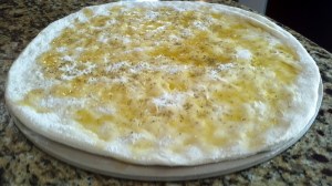 Preparing focaccia with fresh rosemary, garlic, and olive oil from Paggi Pazzo!