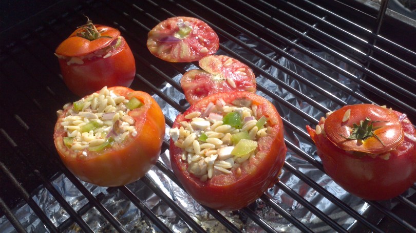 Grilled stuffed tomatoes with Feta cheese, orzo, orzo, onions, and peppers from Paggi Pazzo!