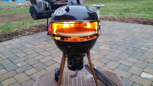 Grill pizza outdoors with Kettle pizza kit