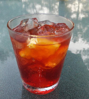 Negroni with St. George Botanivore gin, sweet Vermouth, Campari, club soda and orange peel from Paggi Pazzo